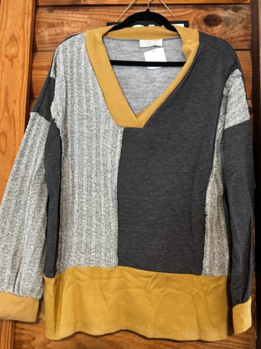 Sugarfox colorblock texture-blocked pullover top